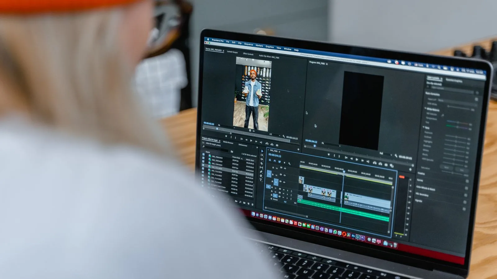 Video editing timeline on a laptop before removing metadata from an MP4 file